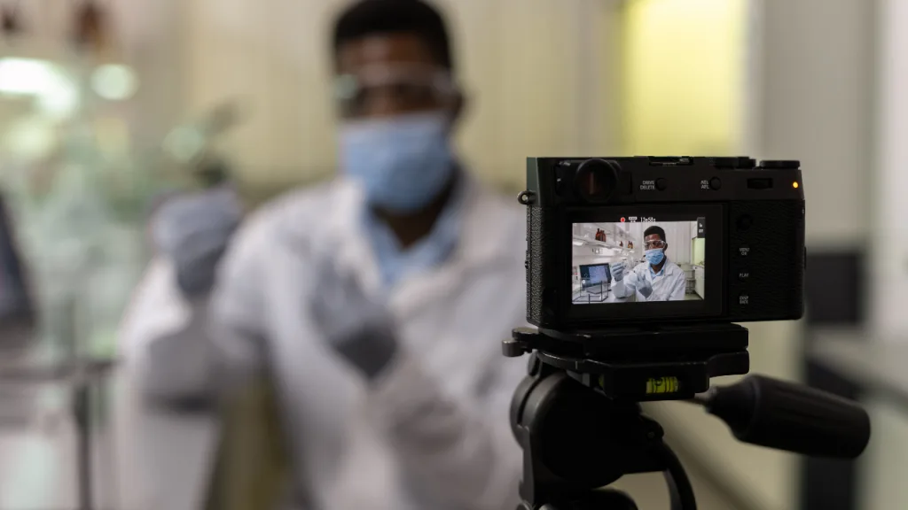 Scientist recording a video in the lab